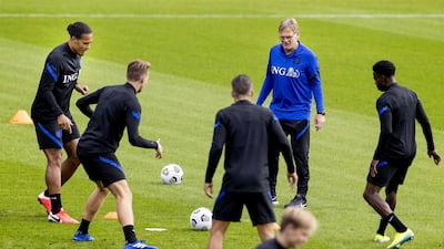 Virgil van Dijk, left, takes part in a training drill. EPA