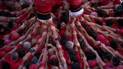 Human towers, known as castells, are created during the La Merce celebrations in Sant Jaume Square, Barcelona, Spain. AP