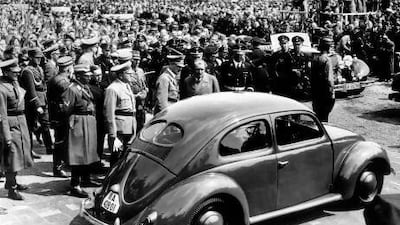 Hitler inspects the new people's car at the Fallensleben factory in 1938; on Hitler's left is the car's designer, Dr Ferdinand Porsche. Popperfoto / Getty Images