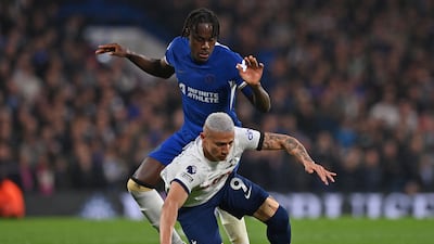 Chelsea defender Trevoh Chalobah, in blue, bundles Tottenham striker Richarlison to the ground during the Premier League match at Stamford Bridge on May 2, 2024. Chelsea won the match 2-0. AFP