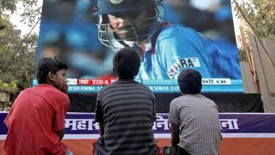 Children watch the 2011 ICC Cricket World Cup semi-final match between India and Pakistan on a big screen in Mumbai. Danish Siddiqui / Reuters