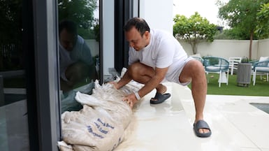 Amit Batra plans to add more sandbags to prevent rainwater from entering his villa in Dubai's Tilal Al Ghaf. Chris Whiteoak / The National