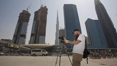 Logan Hicks took thousands of photos to capture the city’s essence for the mural, which will be his contribution to the Dubai Walls initiative. It will likely take months to complete. Randi Sokoloff for The National