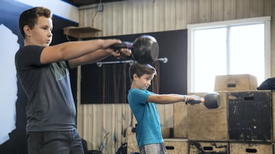 While age is no bar when it comes to lifting weights, parents and instructions must ensure children can follow instructions in a focussed manner. Getty Images