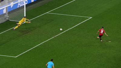Mikautadze of Georgia scores his team's second goal from a penalty. Getty Images