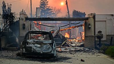 A home continues to burn after the passage of the Palisades Fire in Pacific Palisades, California, on Wednesday. AFP