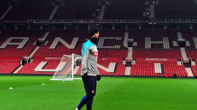 Portugal's Cristiano Ronaldo walks around the pitch during Monday night's team training session at Manchester United's Old Trafford grounds, where he used to play. Paul Ellis / AFP