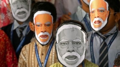 Students in Mumbai celebrate India Prime Minister's Narendra Modi's 75th birthday by donning Modi masks. AFP