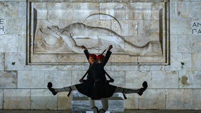 Members of the Presidential Guard at the Tomb of the Unknown Soldier outside the Greek Parliament in Athens. The government plans to ban protests at the memorial after a hunger strike there following a rail disaster. AFP
