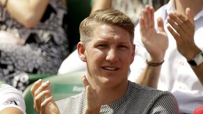 Bastian Schweinsteiger cheers on Ana Ivanovic at Wimbledon. Henry Browne / Reuters