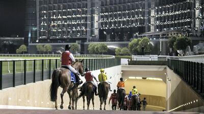 Riders head to the dirt track for Emirates Skywards Handicap 1,600m race at Meydan. Reem Mohammed / The National