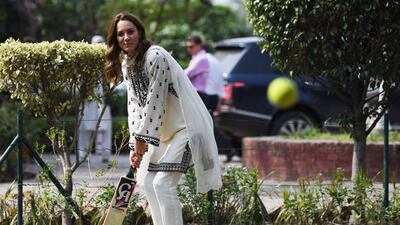The Duchess of Cambridge plays cricket on a visit to the SOS Village on October 18, 2019, in Lahore, Pakistan. Getty Images