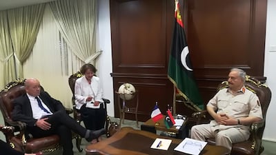 France's Foreign Minister Jean-Yves Le Drian (L) meets with Libya's Field Marshal Khalifa Haftar (R). AFP