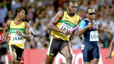 After taking the baton from Yohan Blake, left, Usain Bolt, centre, simply ran away from Walter Dix, right, and all other challengers.