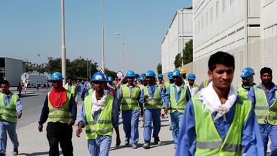 Workers arrive during their lunch break. Christopher Pike / The National