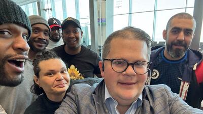 Jonathan Franks with the six US prisoners freed by Kuwait. He helped to secure their release. AP