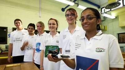 DUBAI, UNITED ARAB EMIRATES ? Sep 16: Left to Right- Dominic Palubiski, Anas Syed, Laura Shaw, Louisa Henson, Naomi Leech and Pooja Nair students of Dubai College with the F1 model race car at Dubai College in Dubai. (Pawan Singh / The National) For Motoring. Story by Richard Whitehead