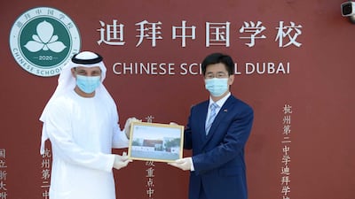 Dr Abdulla Al Karam, director general of the Knowledge and Human Development Authority, and Li Xuhang, China's consul general in Dubai. Dubai Media Office