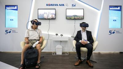 Attendees wear virtual reality (VR) headsets at the Korean Air Lines booth at the IATA annual general meeting in Seoul, South Korea. Bloomberg