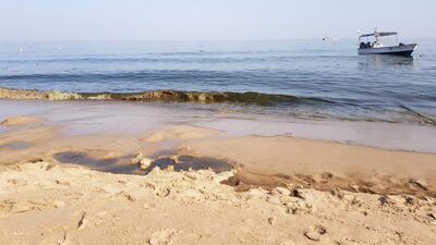 Oil washes onshore at the Miramar hotel from an oil spill out at sea in Al Aqua, Fujairah. Juman Jarallah / The National