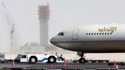 An Etihad A320 becomes the first plane to land on Abu Dhabi International Airport's second runway.