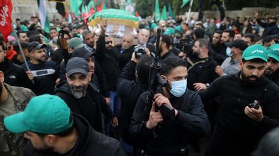 Mr Al Arouri's coffin is carried by supporters. Getty Images