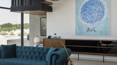 A piece of art by Dale Chihuly is coupled with a portrait of Tupac Shakur, in the far corner, highlighting Canvas' more experimental, eclectic aesthetic. Courtesy KOA