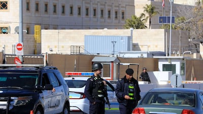 Police officers near the US embassy in Amman. EPA