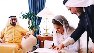 2004: Princess Haya, King Abdullah II of Jordan's sister, signs her wedding register to Sheikh Mohammed bin Rashid, Vice President and Ruler of Dubai, at Baraka Palace in Amman, Jordan, on Saturday April 10, 2004. At the time, Sheikh Mohammed was Crown Prince of Dubai. AP