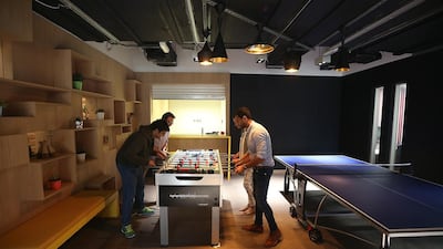 Employees play games at the Google office in Dubai. Satish Kumar / The National