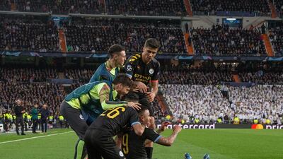 City players celebrate after Jesus levels the scores against Real Madrid in February. City won the match 2-1. EPA