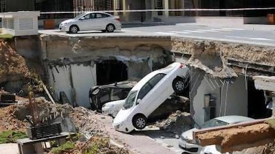 Eight cars were damaged in the collapse but no one was injured.