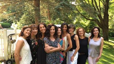 Amy Silverstein, centre with arms folded, surrounded by the friends who helped her overcome a life-threatening condition