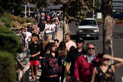 People wait in line to vote outside a polling location on September 14, 2021, in Huntington Beach, California, where President Joe Biden received 54 per cent of the vote. AP