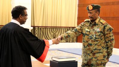 A picture released by Sudan's Presidential Palace shows General Abdel Fattah al-Burhan, the head of Sudan's ruling military council, during a swearing in ceremony in Khartoum on August 21, 2019. Burhan was sworn today as chairman of Sudan's new sovereign council that will steer the country through a three-year transition to civilian rule. "General Abdel Fattah al-Burhan Abdel Rahman was sworn in as president of the sovereign council," the official SUNA news agency reported. / AFP / SUDAN PRESIDENTIAL PALACE / - / RESTRICTED TO EDITORIAL USE - MANDATORY CREDIT "AFP PHOTO / SUDAN PRESIDENTAIL PALACE" - NO MARKETING NO ADVERTISING CAMPAIGNS - DISTRIBUTED AS A SERVICE TO CLIENTS