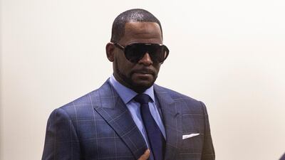 Musician R Kelly arrives at the Daley Center for a hearing in his child support case on Wednesday, March 6, 2019, in Chicago. The singer was charged last month with sexually abusing four females dating back to 1998, including three underage girls. He's pleaded not guilty. Chicago Sun-Times via AP