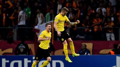 Marco Reus, right, of Borussia Dortmund celebrates after scoring his team's third goal in their 4-0 Champions League win over Galatasaray on Wednesday night in Istanbul. Lars Baron / Getty Images