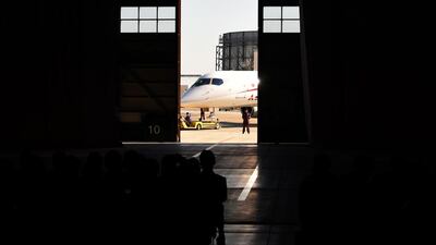 A Mitsubishi Regional Jet (MRJ) moves into the hanger at the ceremony at the Nagoya airport in Komaki. Toshifumi Kitamura / AFP