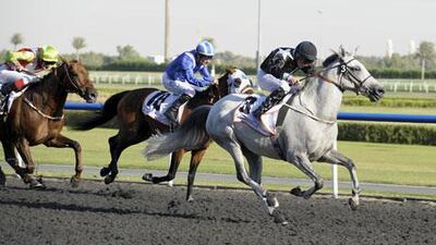 Tadhg O’Shea, on-board Af Alghabra, right, on the way to victory in the Mazrat Al Ruwayah at Meydan Racecourse on Friday.