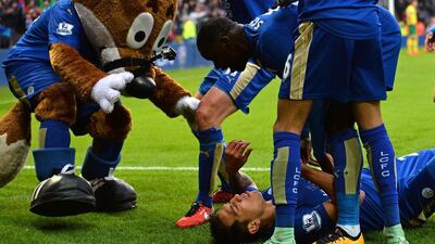 Leicester City players celebrate after their winning goal against Norwich City on Sunday in the Premier League. Paul Ellis / AFP / February 28, 2016