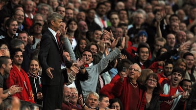 Arsene Wenger's clashes with Manchester United managers have been stuff of legend. Paul Ellis / AFP
