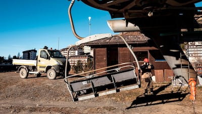 A maintenance man checks a chairlift at the alpine ski resort of Sestriere in Val Susa, Piedmont, Italy. AFP