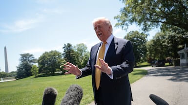 US President Donald Trump speaks to the press, ahead of departing for his trip to China. Reuters