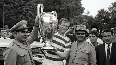 Billy McNeill holds the European Cup after leading Celtic to victory over Inter Milan in Lisbon on May 25, 1967 making the Scottish team the first British team to win the trophy. McNeill died on Monday at age 79. Getty Images