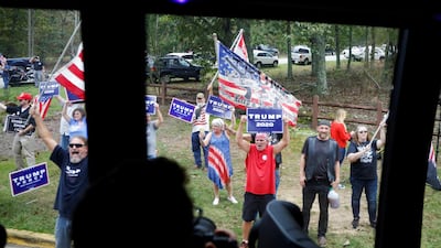 Supporters of US President Donald Trump are seen through a bus window in the motorcade of Democratic US presidential nominee and former Vice President Joe Biden in Warm Springs, Georgia. Reuters