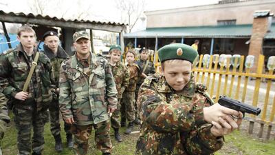 A student from the General Yermolov Cadet School takes part in weapons training during a two-day field exercise near the village of Sengileyevskoye, just outside the south Russian city of Stavropol. The General Yermolov Cadet School in the southern Russian city of Stavropol is a state-run institution that teaches military and patriotic classes in addition to a normal syllabus. Eduard Korniyenko / Reuters