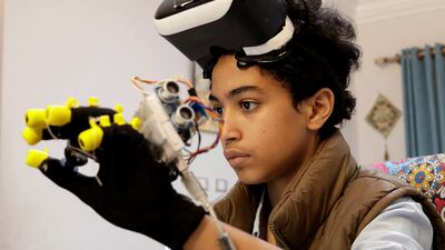Omar Wael, a 13-year-old Egyptian developer, wears a virtual reality (VR) device as he works at his home in Alexandria, Egypt, May 23, 2022. Picture taken May 23, 2022. REUTERS / Mohamed Abd El Ghany