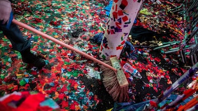 A worker cleans up the area after New Year's Eve celebrations in Times Square in New York. Reuters