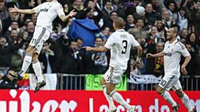 Real Madrid's Arjen Robben, left, celebrates with teammates after scoring against Villarreal.