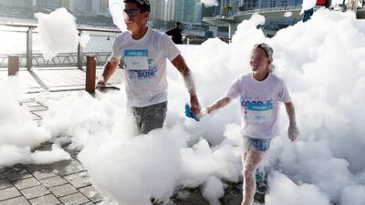 Giant canons were placed along the track, blowing a stream of bubbles on the runners as they passed